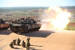 U.S. Marine Lance Cpl. Fernando Griego, gunner, Company K, 3rd Battalion, 4th Marine Regiment, 1st Marine Division, Marine Rotational Force Darwin, remotely fires an M1A1 Abrams with B Squadron 1st Armoured Regiment of the Royal Australian Armoured Corps, May 6, 2017. Marines remotely test fired the Abrams as a precaution after Australian Army soldiers had replaced the barrel ensuring its mission readiness. 