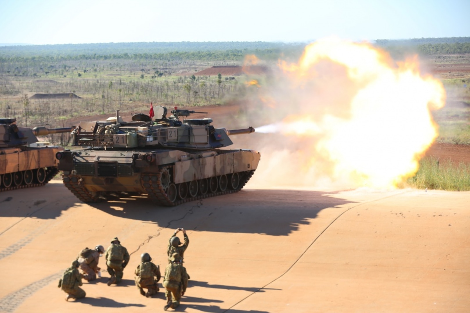 U.S. Marine Lance Cpl. Fernando Griego, gunner, Company K, 3rd Battalion, 4th Marine Regiment, 1st Marine Division, Marine Rotational Force Darwin, remotely fires an M1A1 Abrams with B Squadron 1st Armoured Regiment of the Royal Australian Armoured Corps, May 6, 2017. Marines remotely test fired the Abrams as a precaution after Australian Army soldiers had replaced the barrel ensuring its mission readiness. 