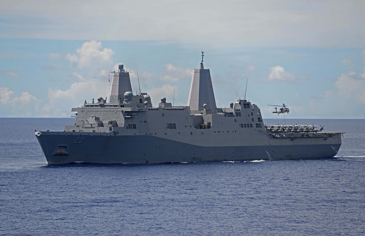 In this file photo, an MH-60 Seahawk assigned to Helicopter Sea Combat Squadron (HSC) 25 drops cargo pallets on the flight deck of the amphibious transport dock USS Green Bay (LPD 20) during replenishment-at-sea (RAS), June 16, 2017. Green Bay, part of the Bonhomme Richard Expeditionary Strike Group, is operating in the Indo-Asia-Pacific region to enhance partnerships and be a ready-response force for any type of contingency. 