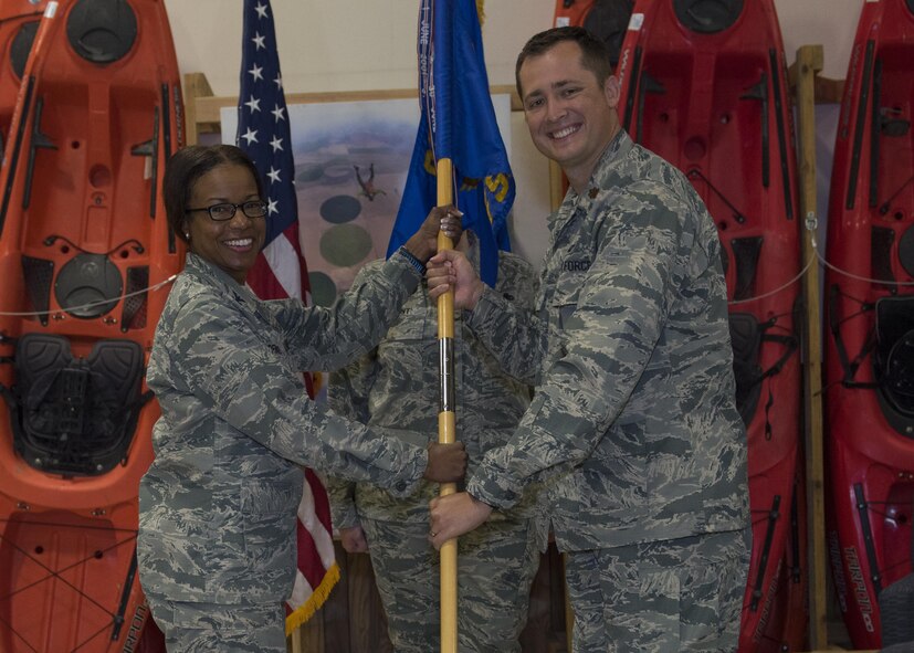Col. Yvonne Spencer, 92nd Mission Support Group commander, gives the 92nd Mission Support Group guideon to Maj. Cody Gravitt, the newly appointed 92nd Force Support Squadron commander, during the FSS change of command ceremony June 27, 2017, at Fairchild Air Force Base, Washington. Gravitt takes over command from Lt. Col. Daniel Rigsbee.
(U.S. Air Force Photo / Airman 1st Class Ryan Lackey)