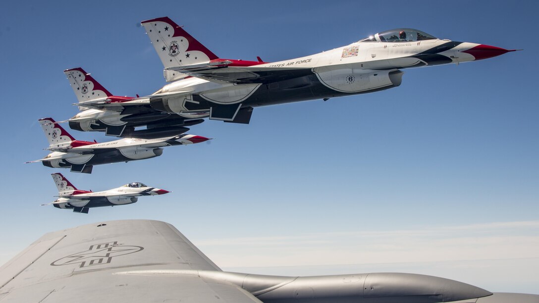 F-16 Fighting Falcon aircraft assigned to the Thunderbirds, the Air Force’s air demonstration squadron, fly alongside a KC-135 Stratotanker en route to Nellis Air Force Base, Nev., June 26, 2017. The KC-135 refueled the aircraft during their flight. Air National Guard photo by Senior Master Sgt. Ralph Branson
