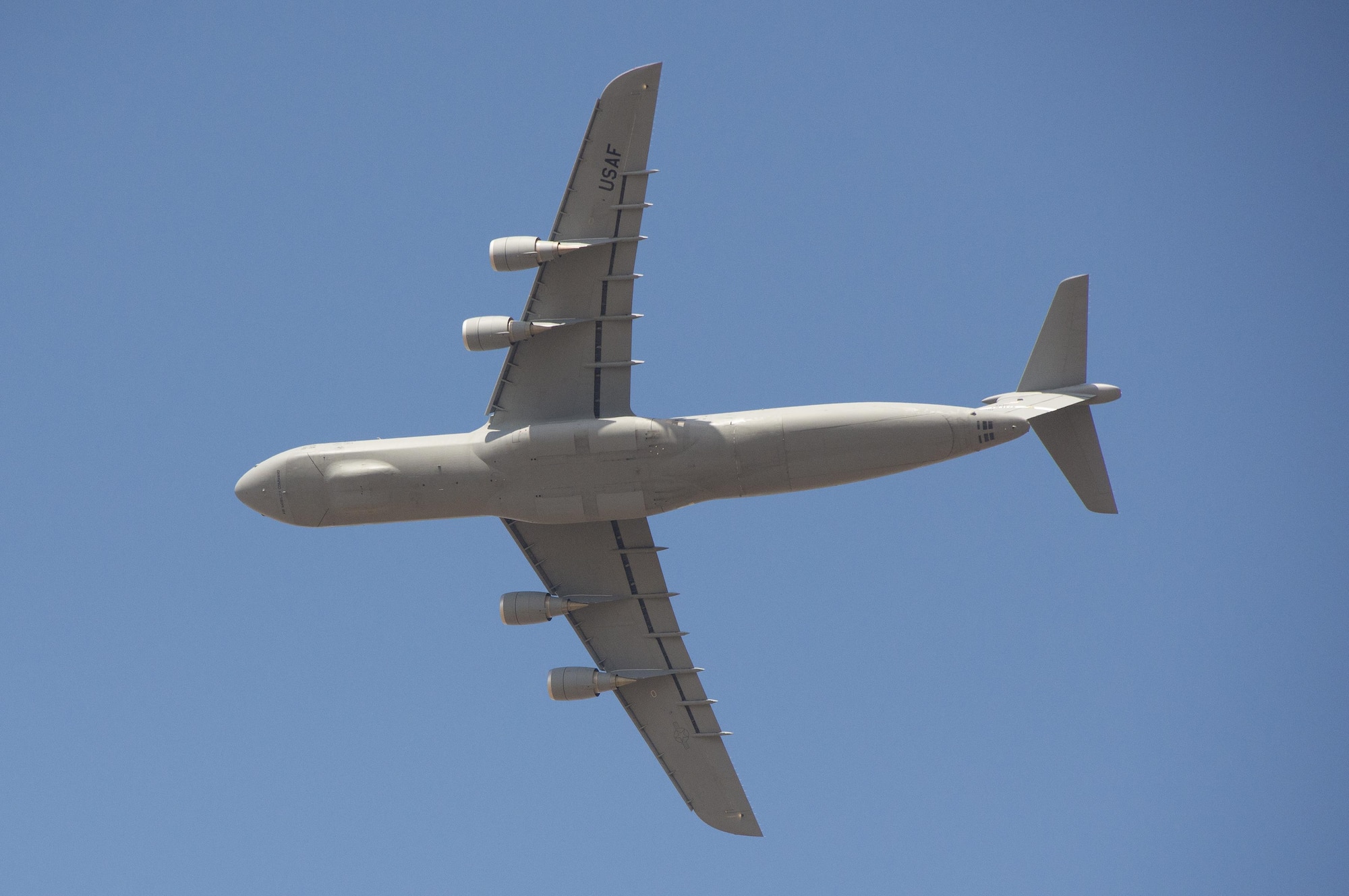 A C-5 M Super Galaxy flies at Travis AFB, California, July 28, 2015. As the Air Force’s largest and only strategic airlifter, the C-5M Super Galaxy can carry more cargo farther distances than any other aircraft. This C-5M Super Galaxy is an upgraded version with new engines and modernized avionics designed to extend its service life beyond 2040. (U.S. Air Force Photograph by Heide Couch)