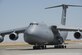 A C-5 M Super Galaxy on the ramp at Travis AFB, California, July 28, 2015. As the Air Force’s largest and only strategic airlifter, the C-5M Super Galaxy can carry more cargo farther distances than any other aircraft. This C-5M Super Galaxy is an upgraded version with new engines and modernized avionics designed to extend its service life beyond 2040. (U.S. Air Force Photograph by Heide Couch)
