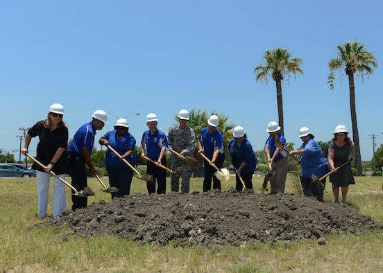 Members of the San Felipe Del Rio Consolidated Independent School District and local civic leaders join U.S. Air Force Col. Thomas Shank in breaking the ground for the future Science, Technology, Mathematics and Engineering Magnet Elementary School at Laughlin Air Force Base,Tx., June 23, 2017. Building this school base will allow students to have direct access to mentors that work in the STEM career field.
