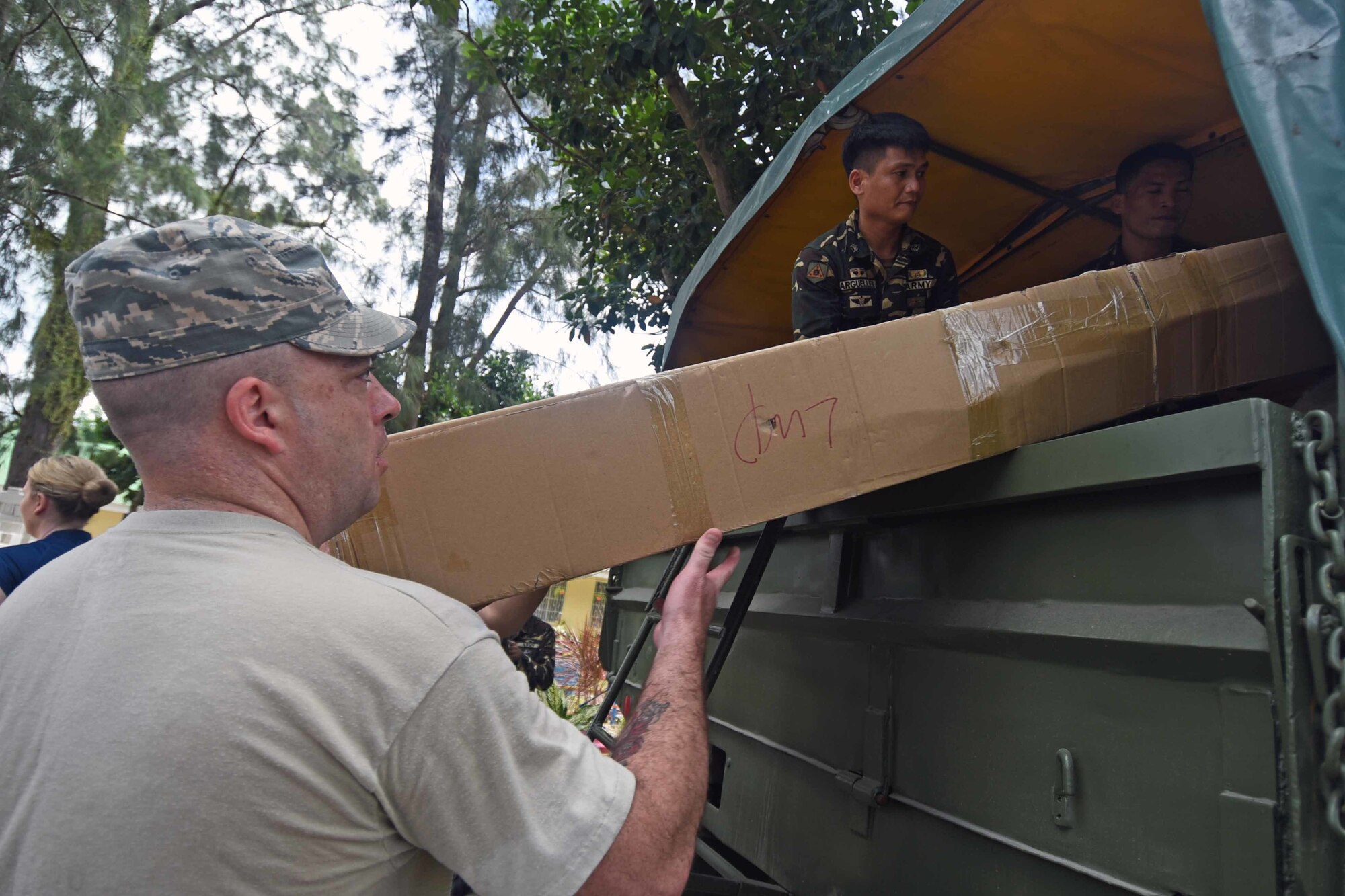 U.S. Air Force Master Sgt. Keith Stolberg, medical logistician with the 673rd Medical Group, Joint Base Elmendorf-Richardson, Alaska, helps unload health services equipment during Pacific Angel (PACANGEL) 2017 in Bogo City, Northern Cebu Province, Philippines, June 24, 2017. Efforts undertaken during PACANGEL help multilateral militaries in the Pacific improve and build relationships across a wide spectrum of civic engagements, which bolsters each nation’s capacity to respond and support future humanitarian assistance and disaster relief operations. (U.S. Air Force photo/Tech. Sgt. Jeff Andrejcik)