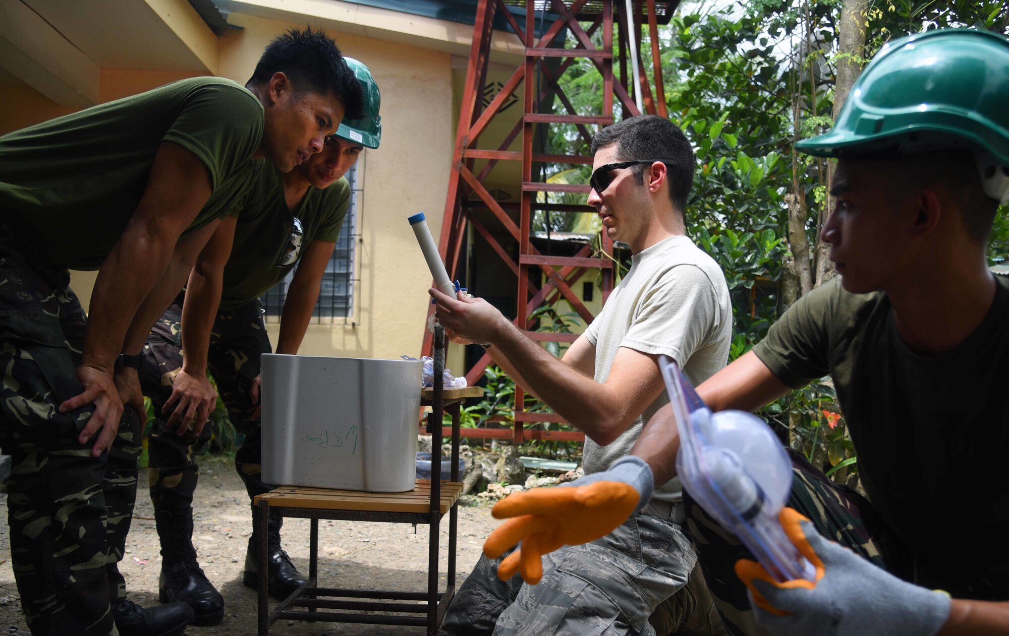 U.S. Air Force Staff Sgt. Alexander Kendrick, engineering plumber with the 354th Civil Engineer Squadron, Eielson Air Force Base, Alaska, middle, provides plumbing installation guidance to Armed Forces of the Philippines members during Pacific Angel (PACANGEL) 2017 in Bogo City, Northern Cebu Province, Philippines, June 24, 2017. Efforts undertaken during PACANGEL help multilateral militaries in the Pacific improve and build relationships across a wide spectrum of civic engagements, which bolsters each nation’s capacity to respond and support future humanitarian assistance and disaster relief operations. (U.S. Air Force photo/Tech. Sgt. Jeff Andrejcik)