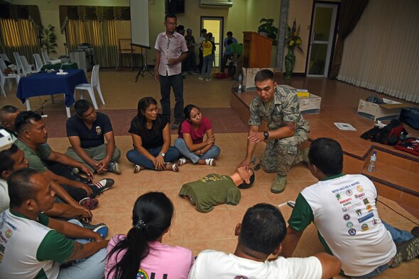U.S. Air Force Senior Airman Alexander Howe, medical technician with the 152nd Nevada Air National Guard, demonstrates cardiopulmonary resuscitation to local Filipino first responders during Pacific Angel 2017 in Northern Cebu Province, Philippines, June 24, 2017. Subject matter expert exchanges like this promote regional military-civilian-nongovernmental organization cooperation and interoperability. (U.S. Air Force photo/Tech. Sgt. Jeff Andrejcik)