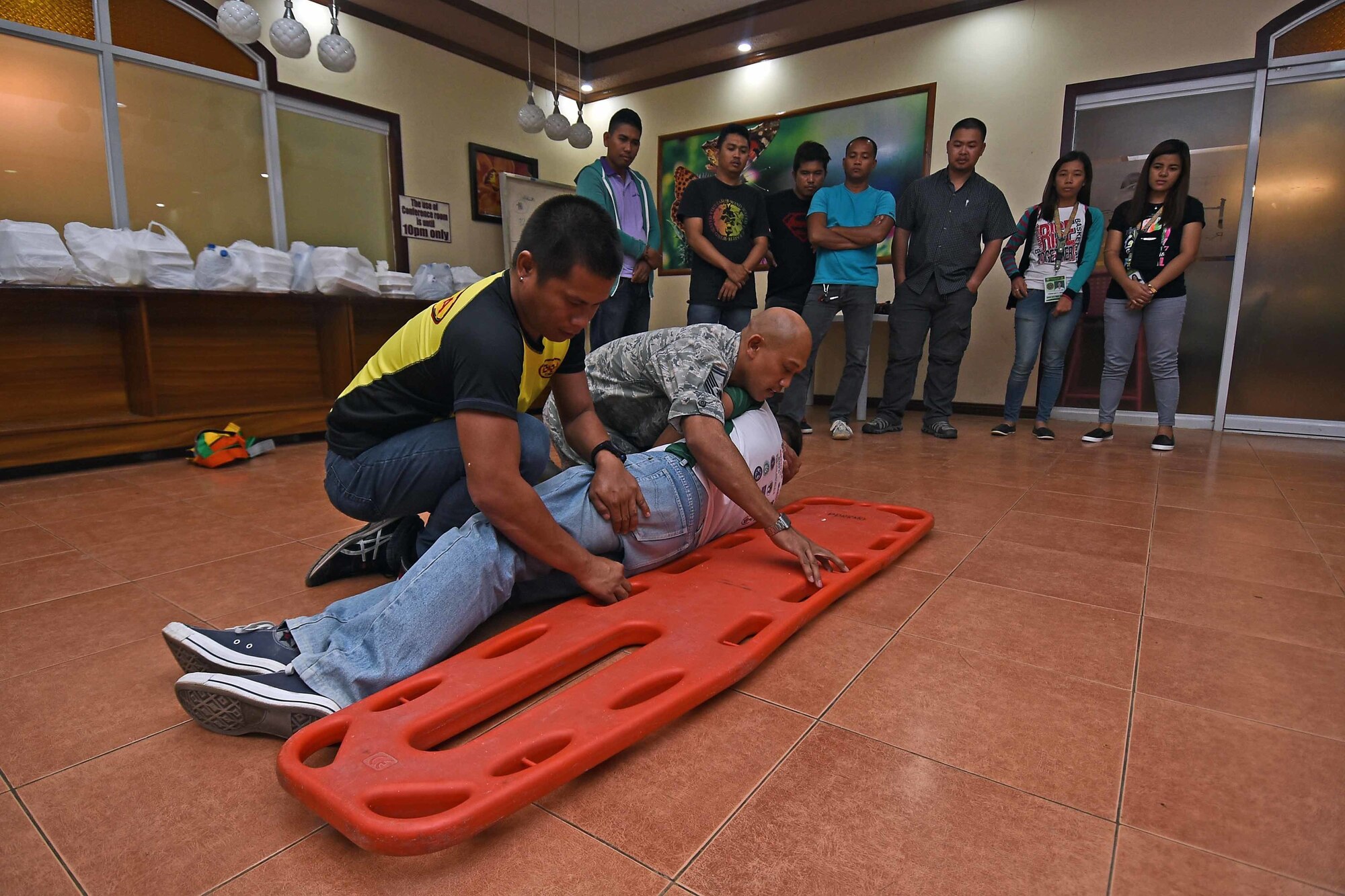 U.S. Air Force Senior Master Sgt. Jerome Capalad, deputy fire chief with the 647th Civil Engineering Squadron, Joint Base Pearl Harbor-Hickam, Hawaii, teaches different methods of removing or transporting a victim away from a hazardous situation to local Filipino first responders during Pacific Angel 2017 in Northern Cebu Province, Philippines, June 24, 2017. Subject matter expert exchanges such as this promote regional military-civilian-nongovernmental organization cooperation and interoperability.  (U.S. Air Force photo/Tech. Sgt. Jeff Andrejcik)
