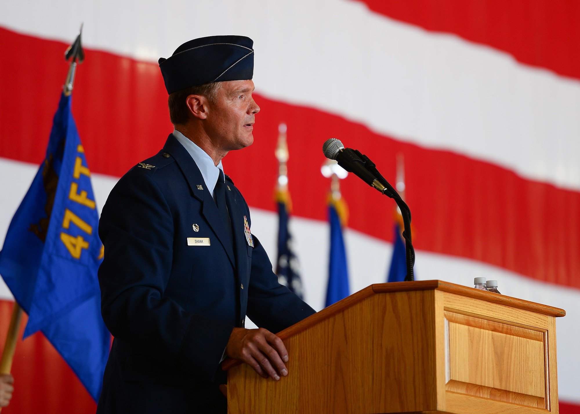 Outgoing commander, U.S. Air Force Col. Thomas Shank gives remarks during the 47th Flying Training Wing’s change of command ceremony at Laughlin Air Force Base, Tx., June 28, 2017.  Col. Shank, a command pilot with over 3,000 flight hours, directed the Air Force’s largest training operation, which exceeds over 80,000 flying hours and 54,000 sorties.