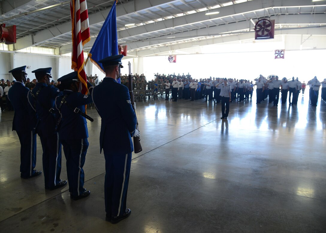 Laughlin Air Force Base’s Honor Guard stands at attention during the 47th Flying Training Wing change of command ceremony at Laughlin Air Force Base, Tx., June 28, 2017.  The Honor Guard, along with attendees and distinguished visitors, helped Laughlin welcome its incoming commander, U.S. Air Force Col. Charles Velino. 