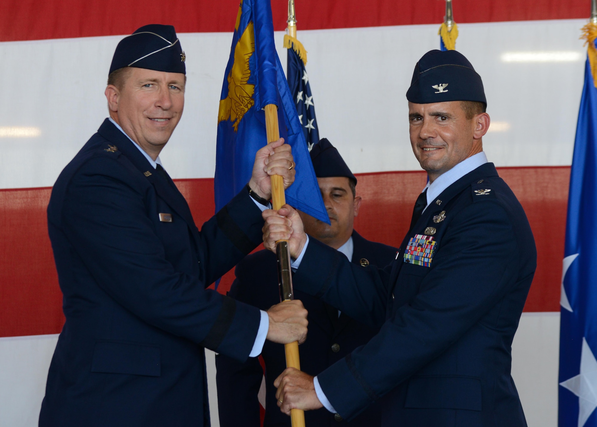 U.S. Air Force Major General Patrick Doherty, 19th Air Force commander, presents the guideon to Col. Charles Velino, incoming 47th Flying Training Wing commander, during the wing’s change of command ceremony at Laughlin Air Force Base, Tx., June 28, 2017. Prior to taking command of the 47th FTW, Velino served as the 15th Operations Group commander at Joint Base Pearl Harbor-Hickam, Hawaii.