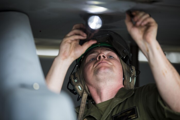 U.S. Marine Corps Sgt. Zachary Jackson, an airframe mechanic with Marine Fighter Attack Squadron (VMFA) 232, conducts maintenance on an F/A-18C Hornet during scheduled phase maintenance at Marine Corps Air Station Iwakuni, Japan, June 27, 2017. When aircraft go through phase maintenance, mechanics are able to perform in-depth maintenance to enhance the welfare of the aircraft. The definitive objective of the evaluation is to ensure mission accomplishment and safety of operations around the Indo-Asia Pacific region. (U.S. Marine Corps photo by Lance Cpl. Mason Roy)