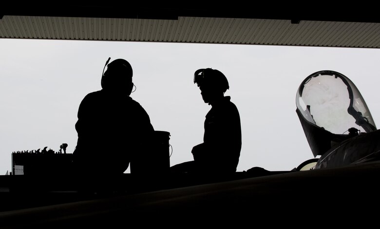 U.S. Marines with Marine Fighter Attack Squadron (VMFA) 232, conduct maintenance on an F/A-18C Hornet during scheduled phase maintenance at Marine Corps Air Station Iwakuni, Japan, June 27, 2017. When aircraft go through phase maintenance, mechanics are able to perform in-depth maintenance to enhance the welfare of the aircraft. The definitive objective of the evaluation is to ensure mission accomplishment and safety of operations around the Indo-Asia Pacific region.  (U.S. Marine Corps photo by Lance Cpl. Mason Roy)
