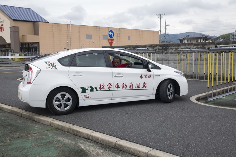 A Marine Corps Air Station Iwakuni resident backs out of a tight parking spot during a free driving course held for station residents in Iwakuni City, Japan, June 28, 2017. Twenty station residents were invited to take part in the short educational workshop aimed to decrease the number of traffic accidents and violations caused by station residents. (U.S. Marine Corps photo by Lance Cpl. Carlos Jimenez)