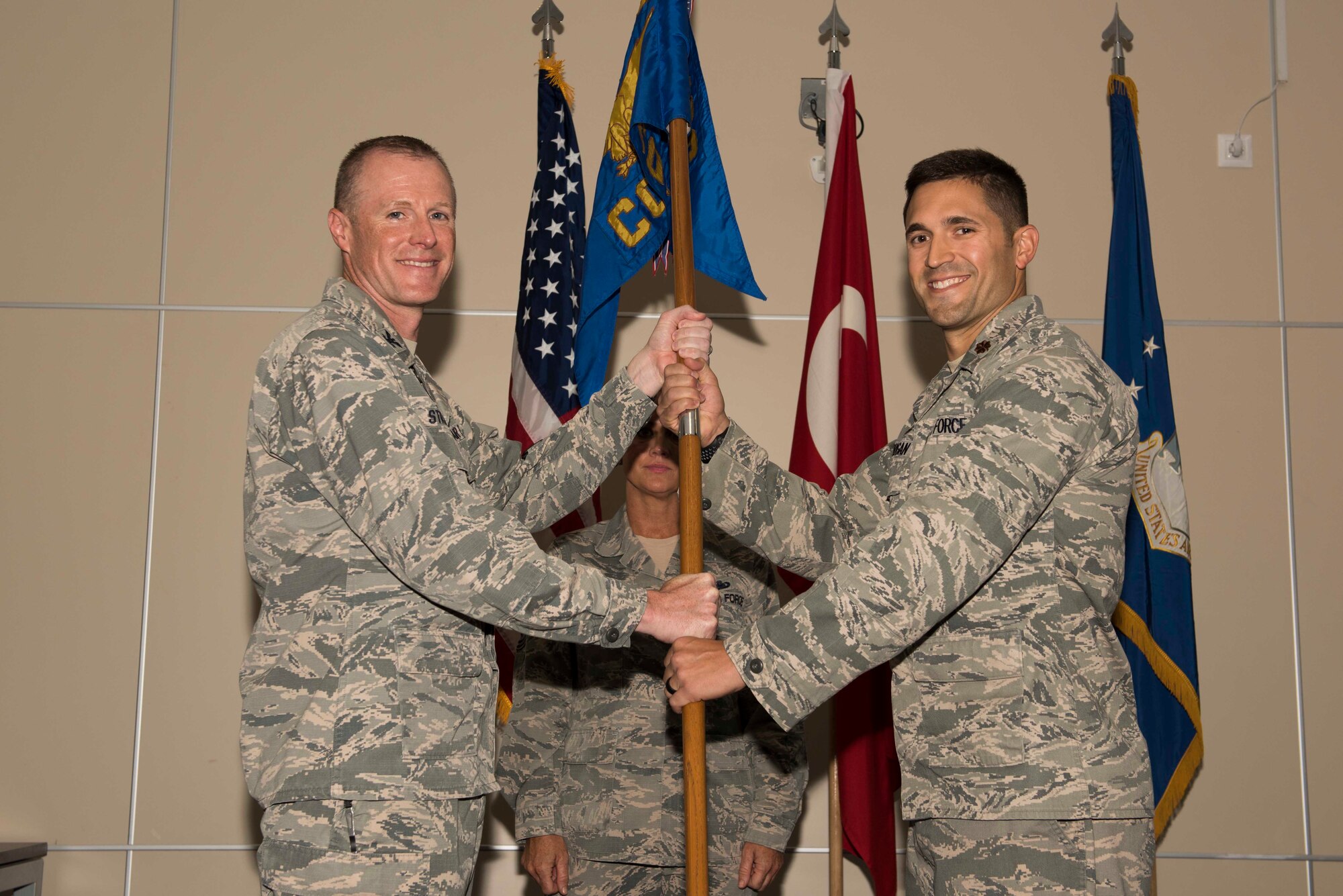 U.S. Air Force Maj. Michael Corrigan (right), 39th Contracting Squadron incoming commander, assumes command from Col. Todd Stratton, 39th Mission Support Group commander, June 28, 2017, at Incirlik Air Base, Turkey. A change of command ceremony is a tradition that represents a formal transfer of authority and responsibility from the outgoing commander to the incoming commander. (U.S. Air Force photo by Airman 1st Class Devin M. Rumbaugh) 