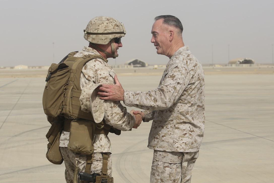 Brig. Gen. Roger Turner, left, the commanding general of Task Force Southwest, greets Gen. Joseph F. Dunford Jr., the chairman of the Joint Chiefs of Staff, at Bastion Airfield, Afghanistan, June 28, 2017. Dunford met with the Task Force’s leadership to reaffirm the Department of Defense’s commitment to the Task Force’s train, advise and assist mission in Helmand Province. (U.S. Marine Corps photo by Sgt. Lucas Hopkins)