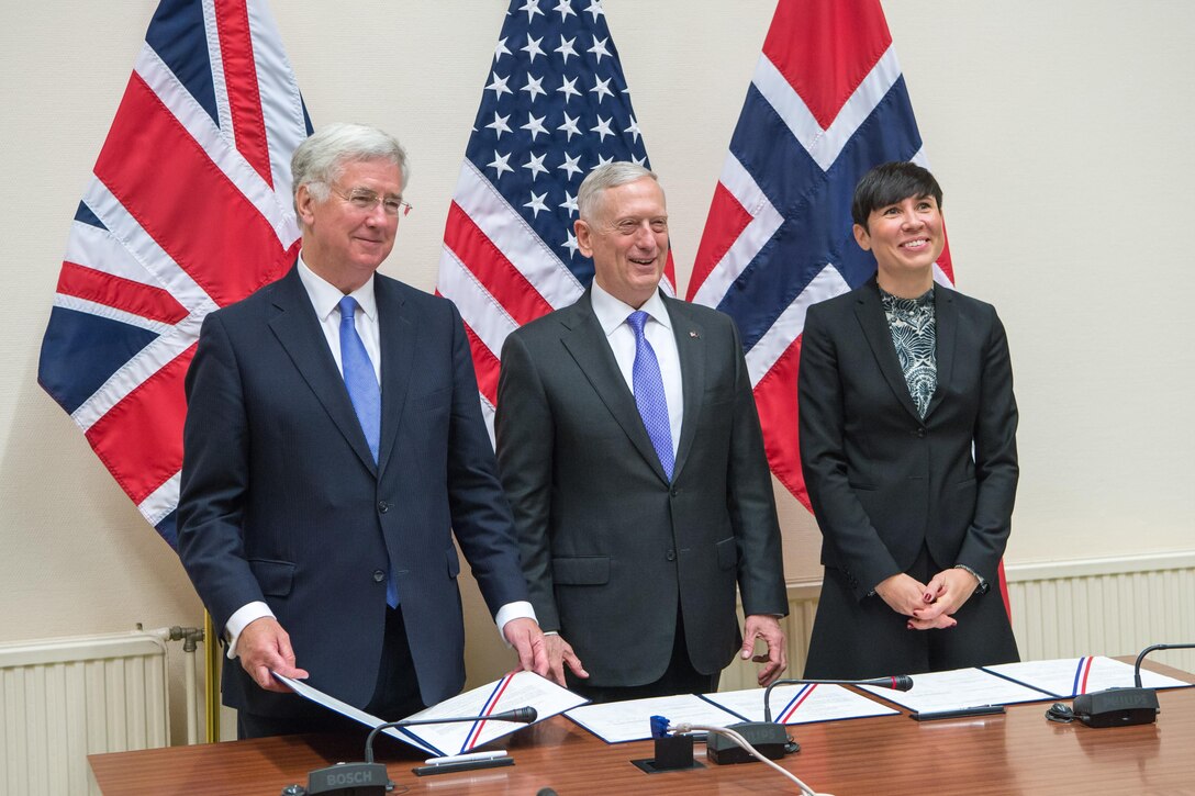 British Defense Secretary Michael Fallon, left,  Defense Secretary Jim Mattis and Norwegian Defense Minister Ine Eriksen Søreide, sign statements of intent at NATO headquarters in Brussels, June 29, 2017. DoD photo by Air Force Staff Sgt. Jette Carr