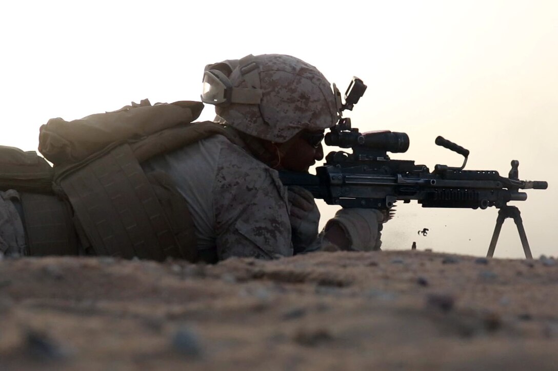 U.S. Marine Corps Lance Cpl. Kervin B. JeaneClaude, a machine gunner with 1st Battalion, 7th Marine Regiment, Special Purpose Marine Air-Ground Task Force-Crisis Response-Central Command, fires an M249 light machine gun during a sustainment range while forward deployed in the Middle East June 6, 2017. This training ensures SPMAGTF Marines sustain vital skills to enhance their ability to react to any mission they may encounter while conducting USCENTCOM’s crisis response mission. (U.S. Marine Corps photo by Cpl. Christopher D. Thompson) 