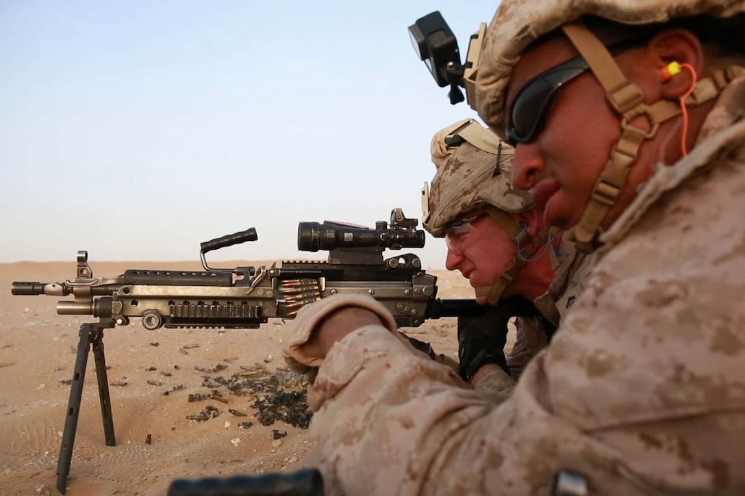 U.S. Marine Corps Lance Cpl. Kervin B. JeaneClaude, a machine gunner, and Cpl. Brandon G. Bilodeau, a machine gunner with 1st Battalion, 7th Marine Regiment, Special Purpose Marine Air-Ground Task Force-Crisis Response-Central Command, fires an M249 light machine gun during a sustainment range while forward deployed in the Middle East June 6, 2017. This training ensures SPMAGTF Marines sustain vital skills to enhance their ability to react to any mission they may encounter while conducting USCENTCOM’s crisis response mission. (U.S. Marine Corps photo by Cpl. Christopher D. Thompson) 