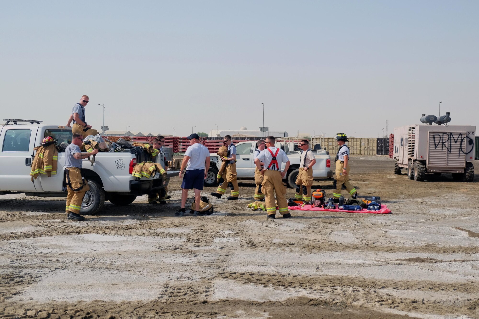 Airmen with the 380th Expeditionary Civil Engineer Squadron Fire Department prepare for vehicle extrication training June 23, 2017, at an undisclosed location in southwest Asia. Training entailed partially dismantling a non-functioning vehicle to gain unimpeded access to the passenger compartment. (U.S. Air Force photo by Senior Airman Preston Webb)
