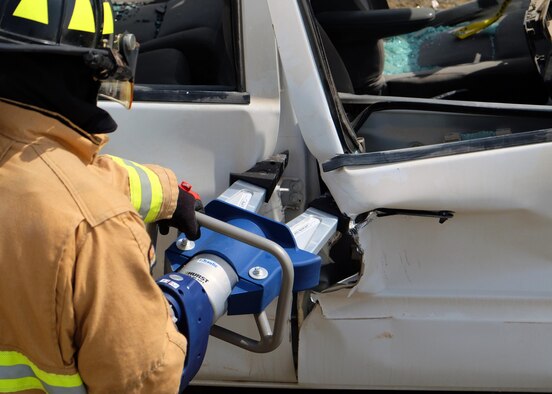 Airmen with the 380th Expeditionary Civil Engineer Squadron Fire Department perform vehicle extrication training June 23, 2017, at an undisclosed location in southwest Asia. The 380 AEW ECES Fire Department recently received portable 'edraulic' cutters and spreaders. (U.S. Air Force photo by Senior Airman Preston Webb)