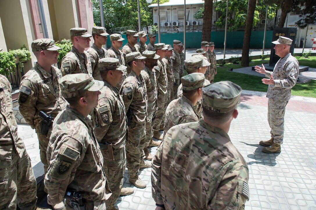 Marine Corps Gen. Joe Dunford, chairman of the Joint Chiefs of Staff, speaks with National Guard soldiers outside the NATO Resolute Support Mission headquarters in Kabul, Afghanistan, June 28, 2017. Gen. Dunford thanked the New York-based 107th Military Police Company soldiers for their convoy operations and security support. DoD photo by Army Sgt. James K. McCann