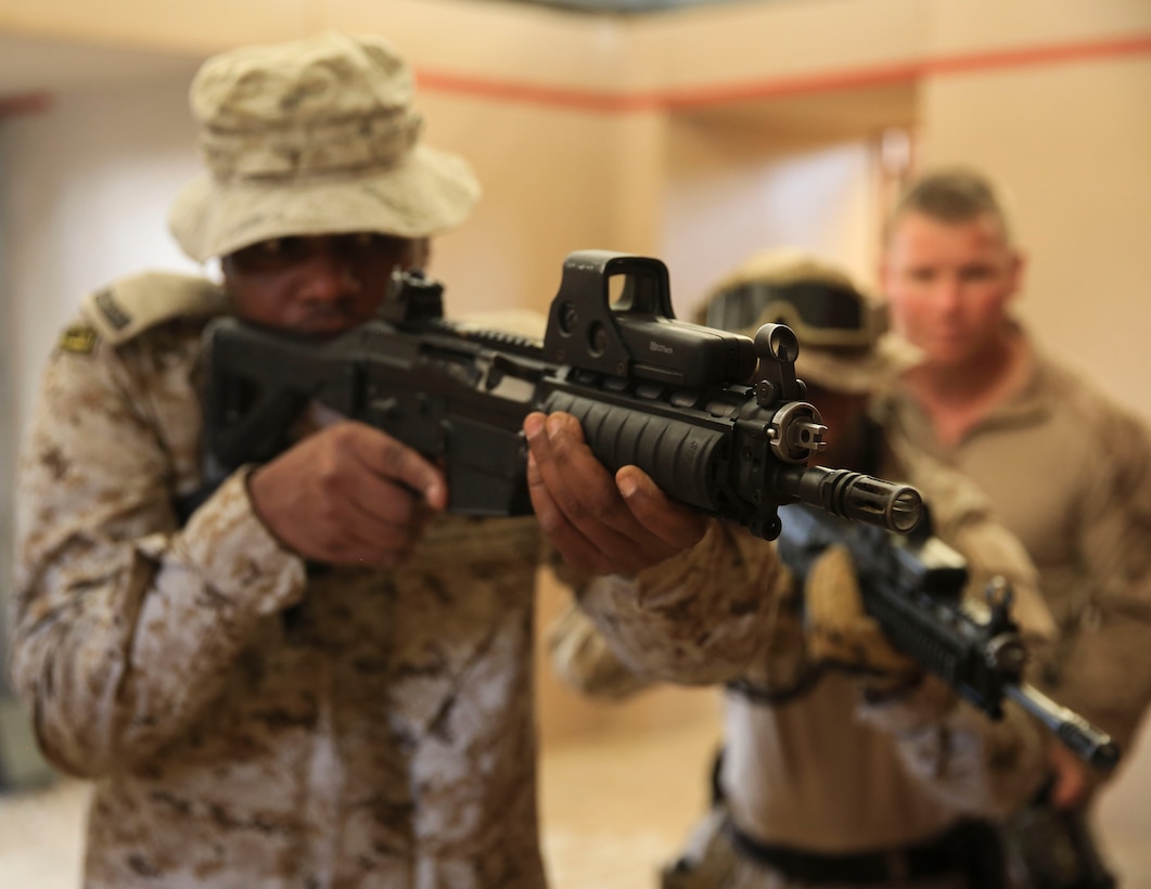 U.S. Marines with Charlie Company, 1st Battalion, 7th Marine Regiment,  Special Purpose Marine Air-Ground Task Force-Crisis Response-Central Command and Saudi Arabian Naval Special Forces practice room clearing during a subject matter expert exchange in Saudi Arabia, May 15, 2017. The exchange proved to be an enhancing opportunity for both the U.S. and Saudi forces. Deploying U.S. Marines into the U.S. Central Command area of responsibility to conduct combined military training with our partner nations’ security forces strengthens our vital relationships with partners in this important region. (U.S. Marine Corps photo by Cpl. Kyle McNan)