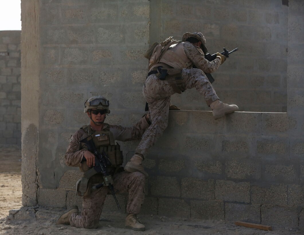 U.S. Marine Corps Lance Cpl. Bobby Cherries, a rifleman with Charlie Company, 1st Battalion, 7th Marine Regiment, Special Purpose Marine Air-Ground Task Force-Crisis Response-Central Command, assists a Saudi Arabian Naval Special Forces Sailor vault through a window during a subject matter expert exchange in Saudi Arabia, May 17, 2017. The exchange proved to be an enhancing opportunity for both the U.S. and Saudi forces. Deploying U.S. Marines into the U.S. Central Command area of responsibility to conduct combined military training with our partner nations’ security forces strengthens our vital relationships with partners in this important region. (U.S. Marine Corps photo by Cpl. Kyle McNan) 
