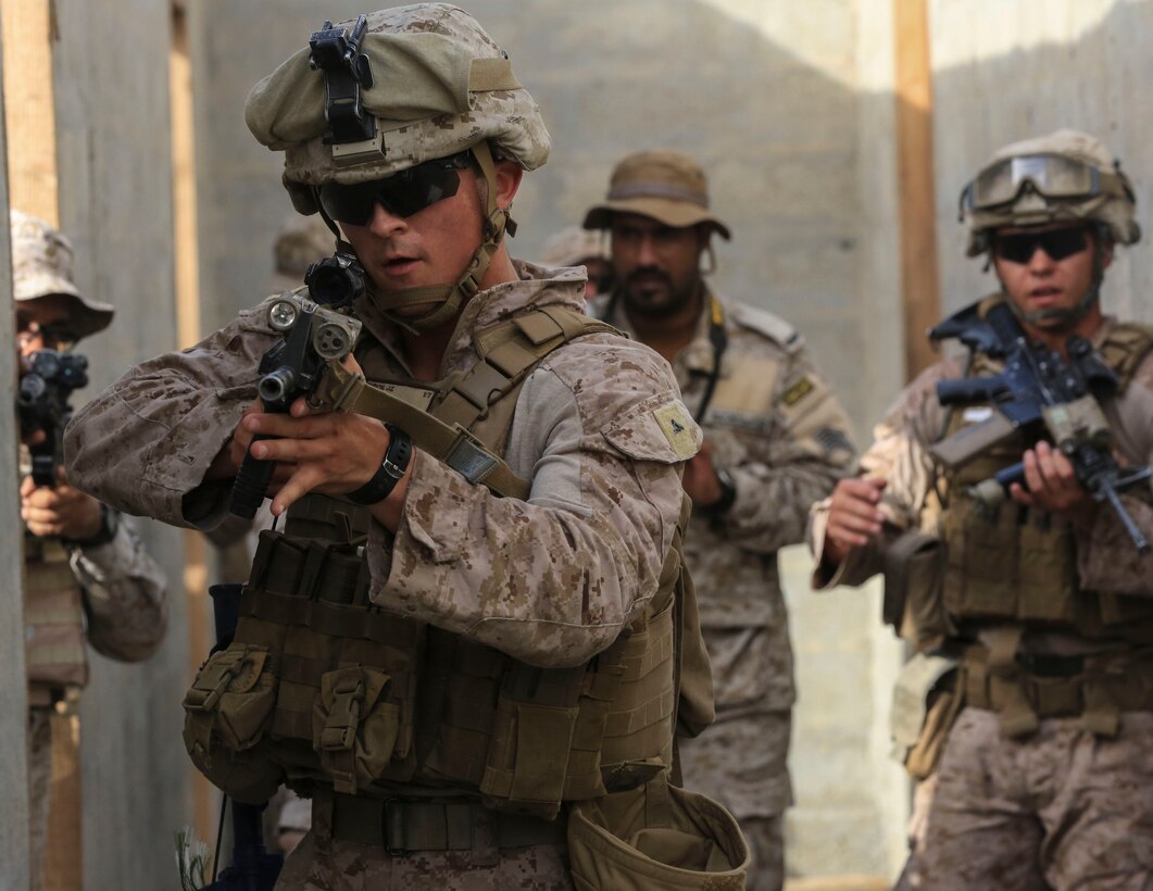 U.S. Marine Corps Lance Cpl. Justin Burch, a rifleman with Charlie Company, 1st Battalion, 7th Marine Regiment, Special Purpose Marine Air-Ground Task Force-Crisis Response-Central Command, raid a building with Saudi Arabian Naval Special Forces during a subject matter expert exchange in Saudi Arabia, May 17, 2017. The exchange proved to be an enhancing opportunity for both the U.S. and Saudi forces. Deploying U.S. Marines into the U.S. Central Command area of responsibility to conduct combined military training with our partner nations’ security forces strengthens our vital relationships with partners in this important region. (U.S. Marine Corps photo by Cpl. Kyle McNan) 