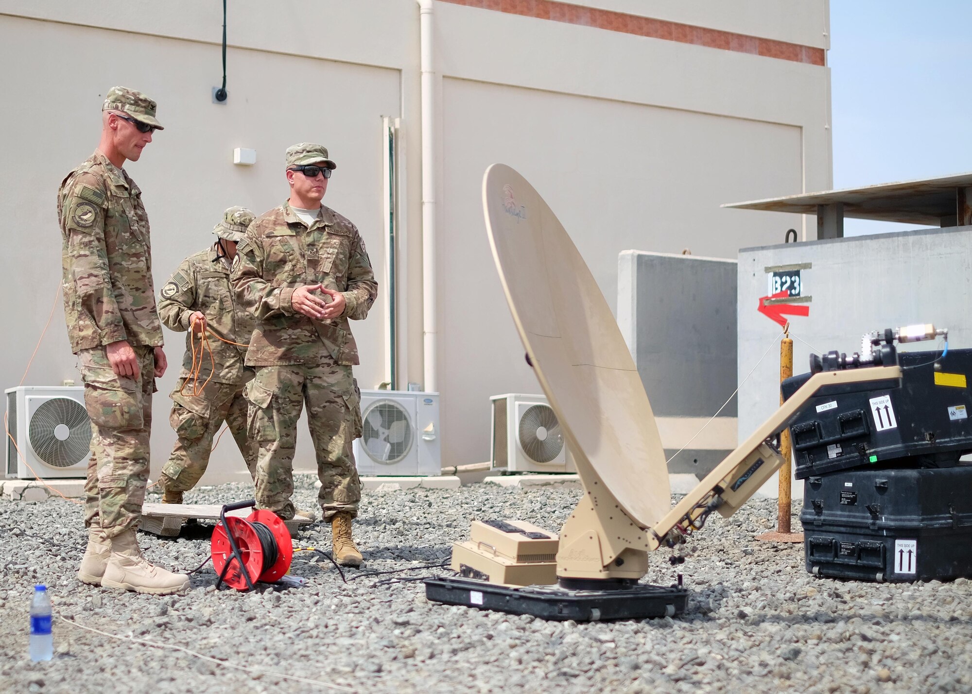 Col. Dee Jay Katzer, left, 380th Expeditionary Mission Support Group commander, discusses Hawkeye satellite setup processes with Staff Sgt. Craig, right, 380th Expeditionary Communication Squadron radio frequency transmissions systems Communications Fly-away Kit 28 team lead, June 27, 2017, at an undisclosed location in southwest Asia. The 380 ECS provided leadership with a hands-on look into the squadron's daily operations. This gives commanders a better understanding of the unit's capabilities and limiting factors. (U.S. Air Force photo by Senior Airman Preston Webb)