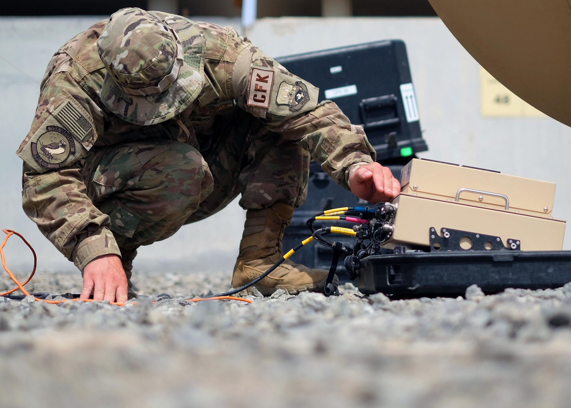 Senior Airman Joseph, 380th Expeditionary Communication Squadron radio frequency transmissions systems Communications Fly-away Kit 30 team lead, verifies data rates and connection status on the Hawkeye satellite June 27, 2017, at undisclosed location in southwest Asia. This Hawkeye satellite is a crucial component of a Communications Fly-away Kit. CFKs can be deployed to remote regions or even locally to maintain secure connections while performing network repairs that would otherwise interrupt installation operations. (U.S. Air Force photo by Senior Airman Preston Webb)