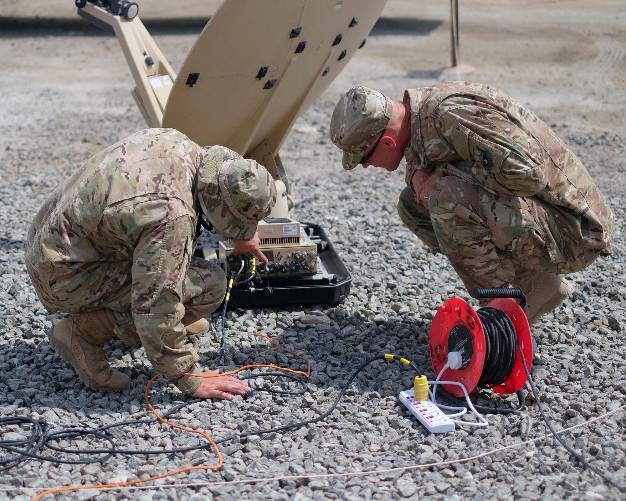 Senior Airman Joseph, left, 380th Expeditionary Communication Squadron radio frequency transmissions systems Communications Fly-away Kit 30 team lead, , examines a Communications Fly-Away Kit, explaining the Hawkeye’s readings and controls to Col. Dee Jay Katzer, 380th Expeditionary Mission Support Group commander, June 27, 2017, at undisclosed location in southwest Asia. Base leadership received hands-on experience with CFKs to better understand their capabilities. This information helps commanders make better use of the kits and Airmen in the future. (U.S. Air Force photo by Senior Airman Preston Webb)