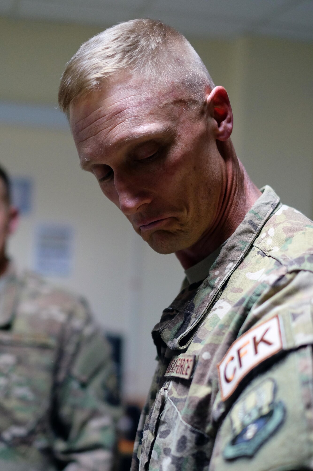 Col. Dee Jay Katzer, 380th Expeditionary Mission Support Group commander, admires an honorary Communications Fly-Away Kit patch June 27, 2017, at an undisclosed location in southwest Asia. The 380 ECS provided leadership with a hands-on look into the squadron's daily operations. Members of the 380 ECS intended for the training to 'demystify' communications processes for commanders. (U.S. Air Force photo by Senior Airman Preston Webb)