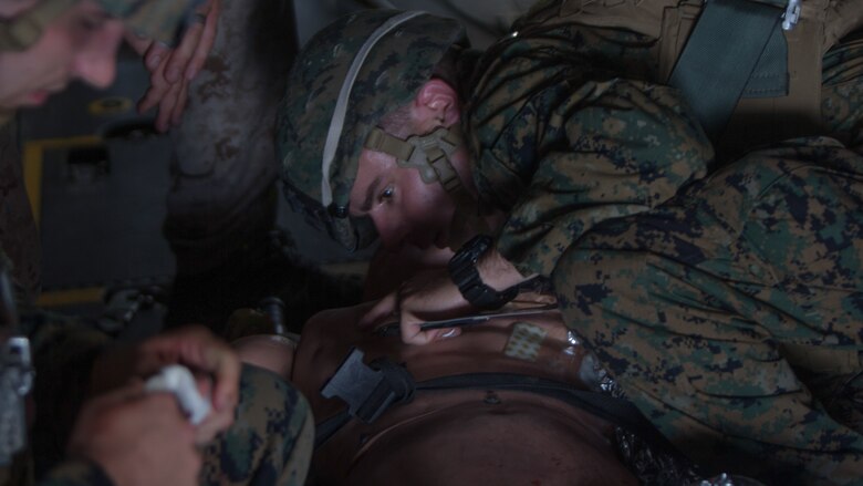 Seaman Tyler Kelly provides medical care to a dummy during a Tactical Evacuation Course at Camp Lejeune, N.C., June 27, 2017. The course consisted of corpsmen identifying dummy casualties and assessing them for injuries ranging from gunshot wounds, amputations to severe trauma and treating them accordingly, followed by stabilizing and evacuating the casualty with an MV-22 Osprey.