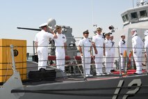 170617-N-XP344-055 MANAMA, Bahrain (June 27, 2017) From left, Lt. Cmdr. Timothy Yuhas, a native of Cave Creek, Arizona and former commanding officer of the Cyclone-class coastal patrol ship USS Thunderbolt (PC 12), salutes Lt. Cmdr. Michael T. McArawas, a native of Erie, Pennsylvania and current commanding officer, during a change of command ceremony held shipboard while pierside at Naval Support Activity Bahrain. Thunderbolt is one of 10 PCs forward deployed to Manama, Bahrain, whose mission is coastal patrol and interdiction surveillance. (U.S. Navy photo by Mass Communication Specialist 2nd Class Victoria Kinney)