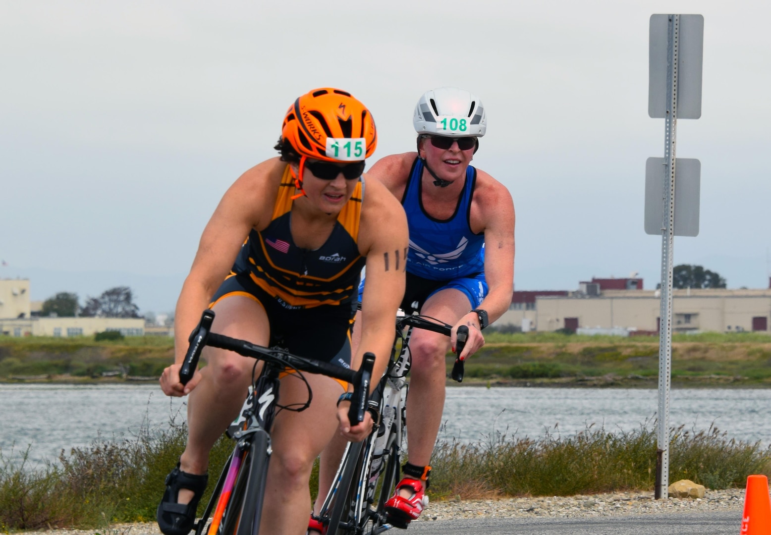Point Mugu, Calif. (June 10, 2017) Army 1st Lt. Justine Emge is just ahead of Air Force Maj. Judith Coyle as they finish the 10-kilometer bike portion of the Armed Forces Triathlon. (U.S. Navy photo by Theresa Miller/Released)
