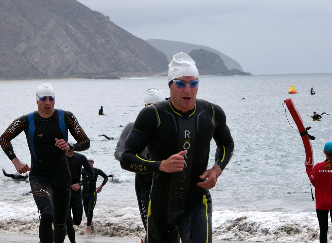 Point Mugu, Calif. (June 10, 2017) Navy Lt. Kyle Hooker and Navy Lt. Thomas Brown are first and second to complete the one-mile ocean swim at Point Mugu beach in the first leg of the Armed Forces Triathlon. (U.S. Navy photo by Theresa Miller/Released)