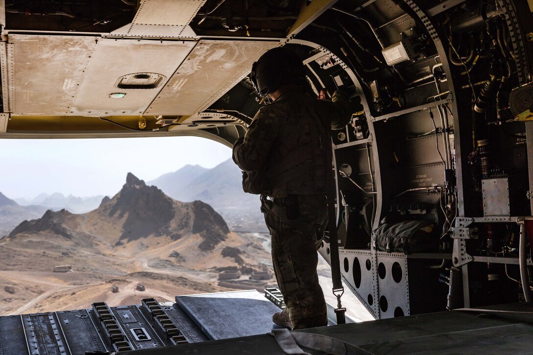 An Army Reserve pilot scans the terrain below before landing at Kandahar Airfield, Afghanistan, June 21, 2017. Army photo by Capt. Brian Harris