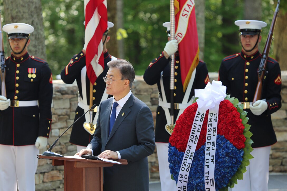 On Wednesday, June 28, 2017, members of the Marine Band supported a wreath-laying ceremony in honor of the Marines who fought in the Korean War. President Moon Jae-in of the Republic of Korea honored the Marines at the Korean War Chosin Monument at the National Museum of the Marine Corps. In 1950, President Moon's parents were able to flee to South Korea after the 1st Marine Division drove the enemy back. Today, he showed his gratitude for all the Marine Corps did for his family. (U.S. Marine Corps photo by Gunnery Sgt. Rachel Ghadiali/released)