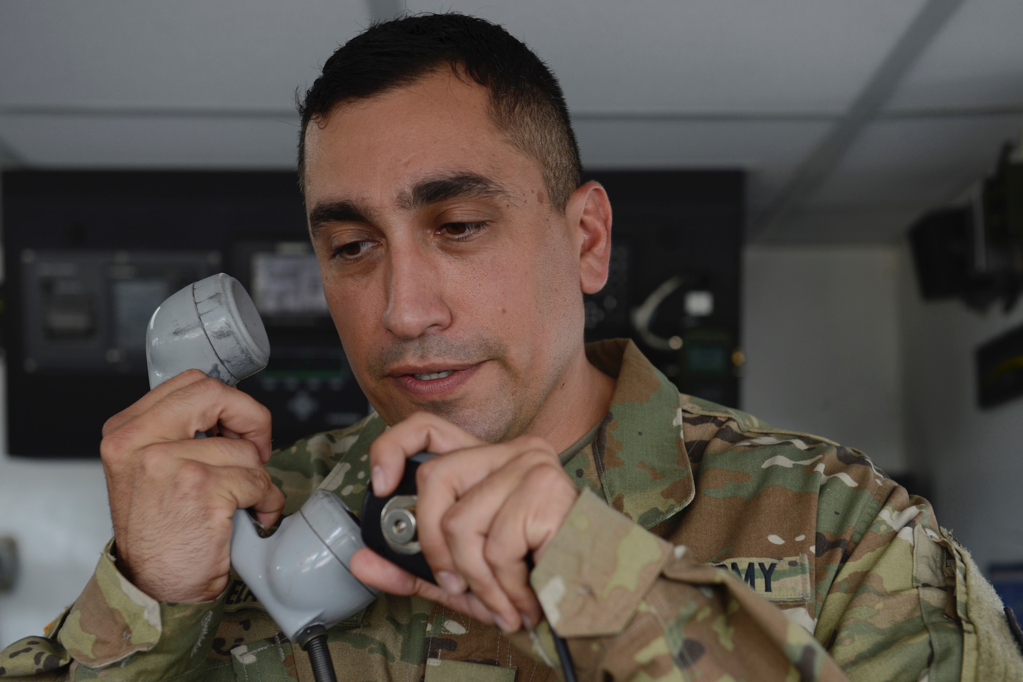 U.S. Army Spc. Miguel Ruelas Trejo, 335th Transportation Detachment, 7th Transportation Brigade (Expeditionary) quartermaster, makes an announcement over the intercom to members aboard General Frank S. Besson-class logistics support vessel at Joint Base Langley-Eustis, Va., June 23, 2017. As a quartermaster, Ruelas Trejo keeps track of crew lists, manages the navigation charts and maintains the ship’s logs. (U.S. Air Force photo/Airman 1st Class Kaylee Dubois)