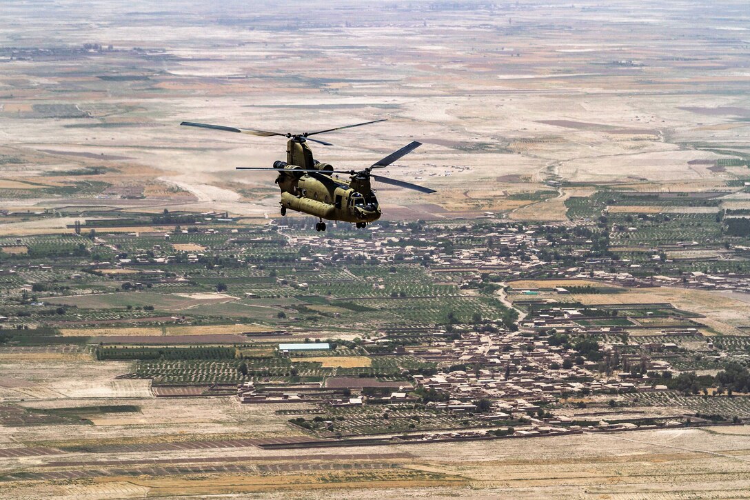 A CH-47 Chinook helicopter moves above Helmand province, Afghanistan, June 21, 2017. Army photo by Capt. Brian Harris