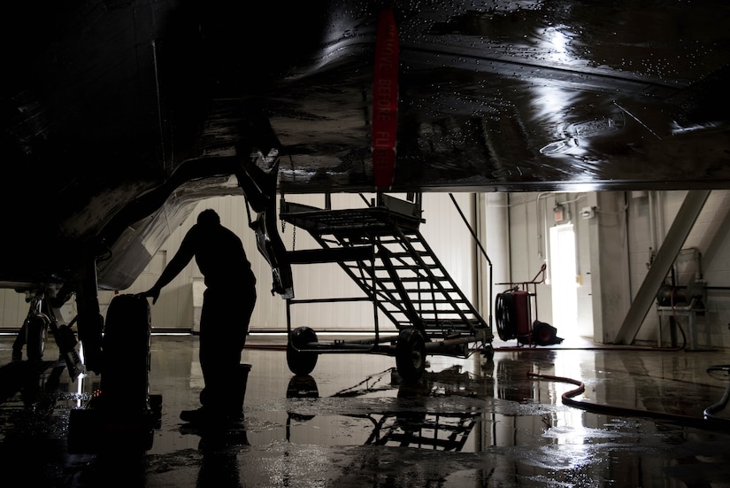 U.S. Air Force Airman 1st Class Samuel Rivera, 1st Aircraft Maintenance Squadron, 27th Aircraft Maintenance Unit crew chief, cleans the landing gear of a F-22 Raptor in the wash rack at Joint Base Langley-Eustis, Va., June 19, 2017. By washing the F-22, it allows the crew chiefs to better see discrepancies on the aircraft. (U.S. Air Force photo/Staff Sgt. J.D. Strong II)