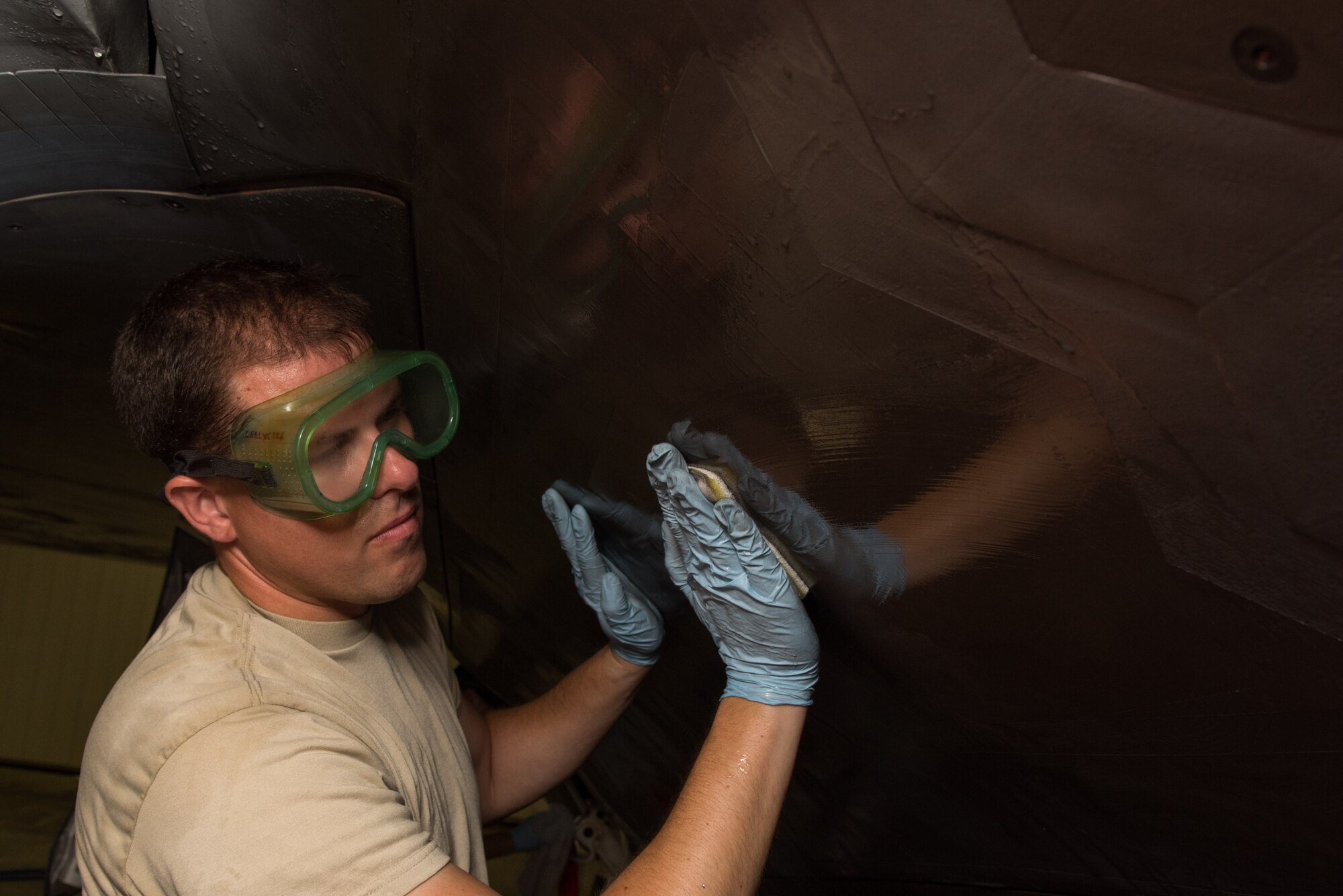 U.S. Air Force Staff Sgt. Jason Frederick, 1st Aircraft Maintenance Squadron, 27th Aircraft Maintenance Unit crew chief, washes a F-22 Raptor in the wash rack at Joint Base Langley-Eustis, Va., June 19, 2017. Washing the Raptor, lengthens the life of  the jeft and coating, which saves money, man and flight hours.(U.S. Air Force photo/Staff Sgt. J.D. Strong II)