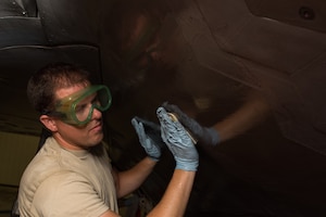 U.S. Air Force Staff Sgt. Jason Frederick, 1st Aircraft Maintenance Squadron, 27th Aircraft Maintenance Unit crew chief, washes a F-22 Raptor in the wash rack at Joint Base Langley-Eustis, Va., June 19, 2017. Washing the Raptor, lengthens the life of  the jeft and coating, which saves money, man and flight hours.(U.S. Air Force photo/Staff Sgt. J.D. Strong II)