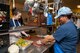 2nd Lt. Caitlyn McIntyre (left) and Tonya Shelton (right), prepare materials for cooking at the House of Bread Dayton during a KC-46 Program Office volunteer opportunity there June 28, 2017. McIntyre, a KC-46 program manager, and Shelton, a KC-46 financial specialist, are part of a 15-person volunteer team providing more than 270 meals to Dayton community members in need this day. (U.S. Air Force photo/John Harrington)