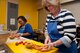 Jennifer Brown (left) and Teresa Zack (right), clean and prepare fresh fruit at the House of Bread Dayton during a KC-46 Program Office volunteer opportunity there June 28, 2017. Brown, of KC-46 Configuration Management, and Shelton, KC-46 Configuration Management chief, are part of a 15-person volunteer team providing more than 270 meals to Dayton community members in need this day. (U.S. Air Force photo/John Harrington)