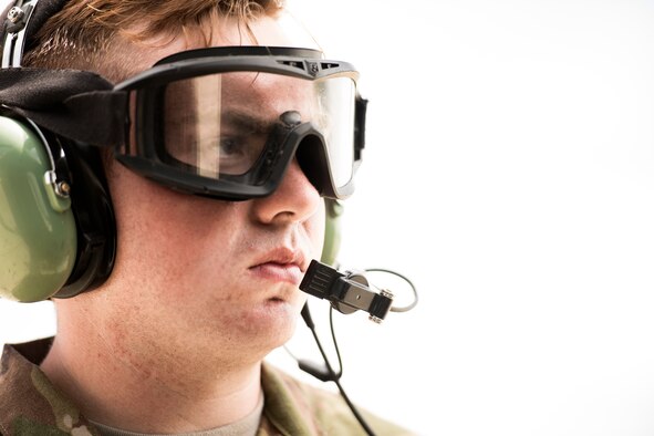 A helicopter maintainer from the 41st Helicopter Maintenance Unit waits to launch an HH-60G Pave Hawk prior to 23d Wing commander Col Thomas Kunkel’s fini-flight, June 27, 2017, at Moody Air Force Base, Ga. The fini-flight is a long-standing Air Force tradition that occurs when a pilot departs from the base. Upon completion of their final flights, military aviators are hosed down with water or champagne by their family and friends before they depart their unit. (U.S. Air Force photo by Staff Sgt. Ryan Callaghan)
