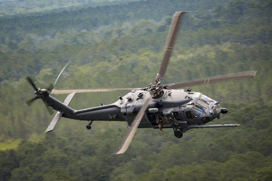 An HH-60G Pave Hawk from the 41st Rescue Squadron flies over Grand Bay Bombing and Gunnery Range during 23d Wing commander Col. Thomas Kunkel’s fini-flight, June 27, 2017, at Moody Air Force Base, Ga. The fini-flight is a long-standing Air Force tradition that occurs when a pilot departs from the base. Upon completion of their final flights, military aviators are hosed down with water or champagne by their family and friends before they depart their unit. (U.S. Air Force photo by Staff Sgt. Ryan Callaghan)