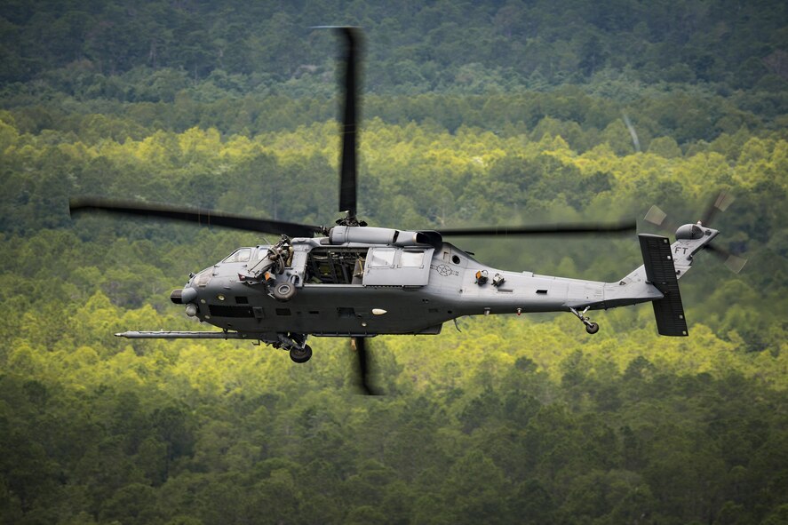 An HH-60G Pave Hawk from the 41st Rescue Squadron flies over Grand Bay Bombing and Gunnery Range during 23d Wing commander Col. Thomas Kunkel’s fini-flight, June 27, 2017, at Moody Air Force Base, Ga. The fini-flight is a long-standing Air Force tradition that occurs when a pilot departs from the base. Upon completion of their final flights, military aviators are hosed down with water or champagne by their family and friends before they depart their unit. (U.S. Air Force photo by Staff Sgt. Ryan Callaghan)