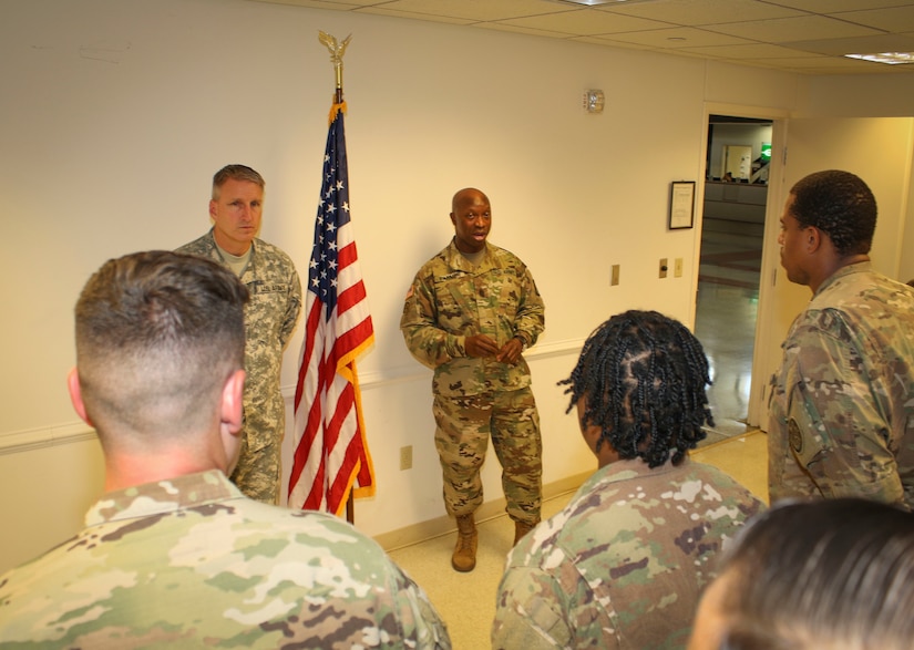 Col. Todd Peterson (left), force management director and acting G-3 operations officer, 335th Signal Command (Theater), and Command Sgt. Maj. Ronnie Farmer, command sergeant major, 335th SC (T) speak to a group of twelve Soldiers assigned to Detachment 1, 335th SC (T), during a welcome home warrior citizen ceremony at the Killeen Regional Airport, Killeen, Texas June 28.  The Soldiers returned from a nine-month deployment where their mission  providing communications support to a special operations joint task force, as part of Operation Inherent Resolve.  (Official U.S. Army Reserve photo by Sgt. 1st Class Brent C. Powell)